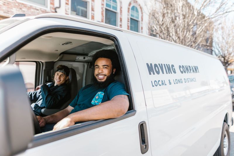 Moving crew in a van cab before a long-distance relocation from Coimbatore